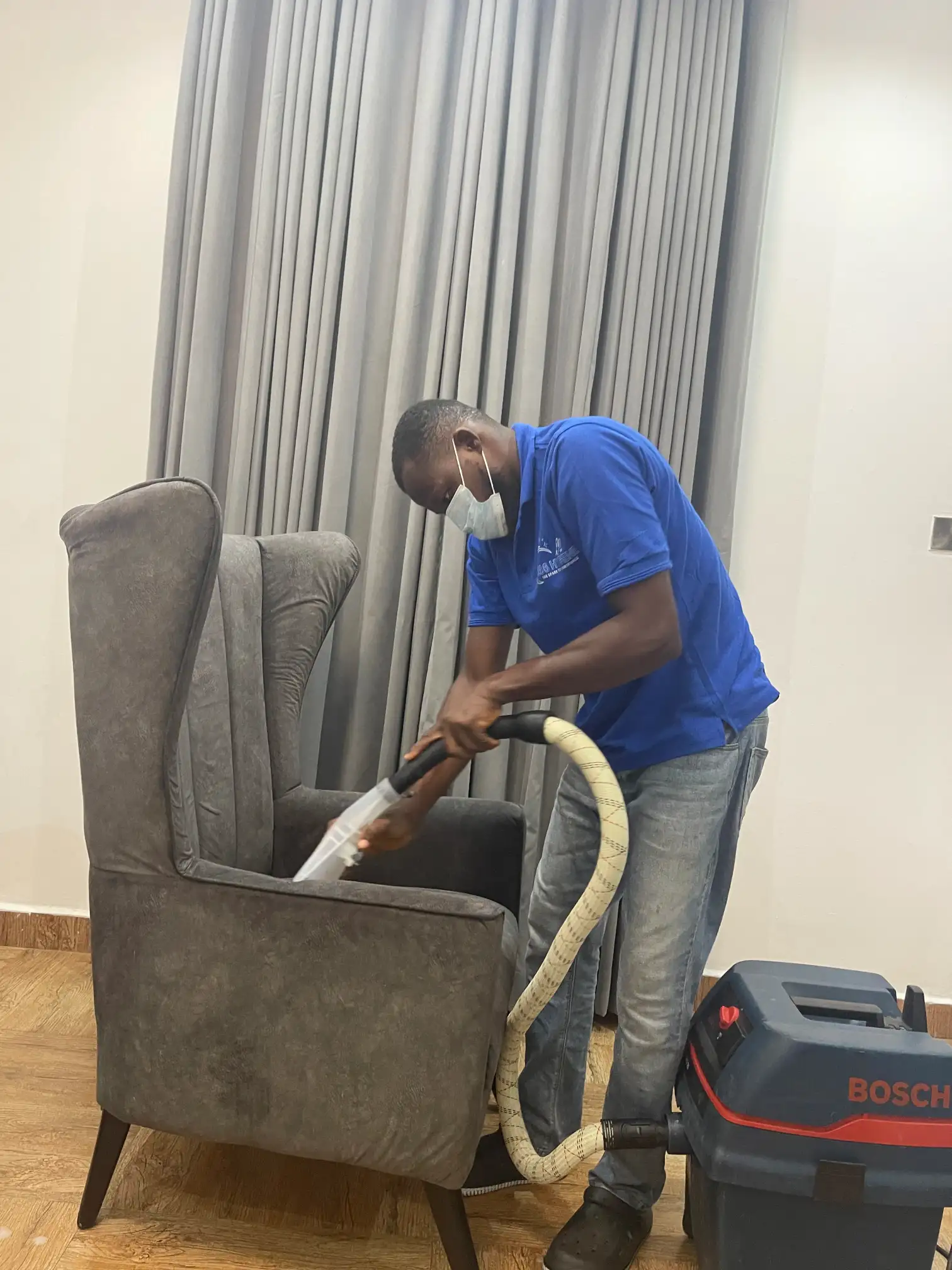 Deep cleaning upholstery on a sofa